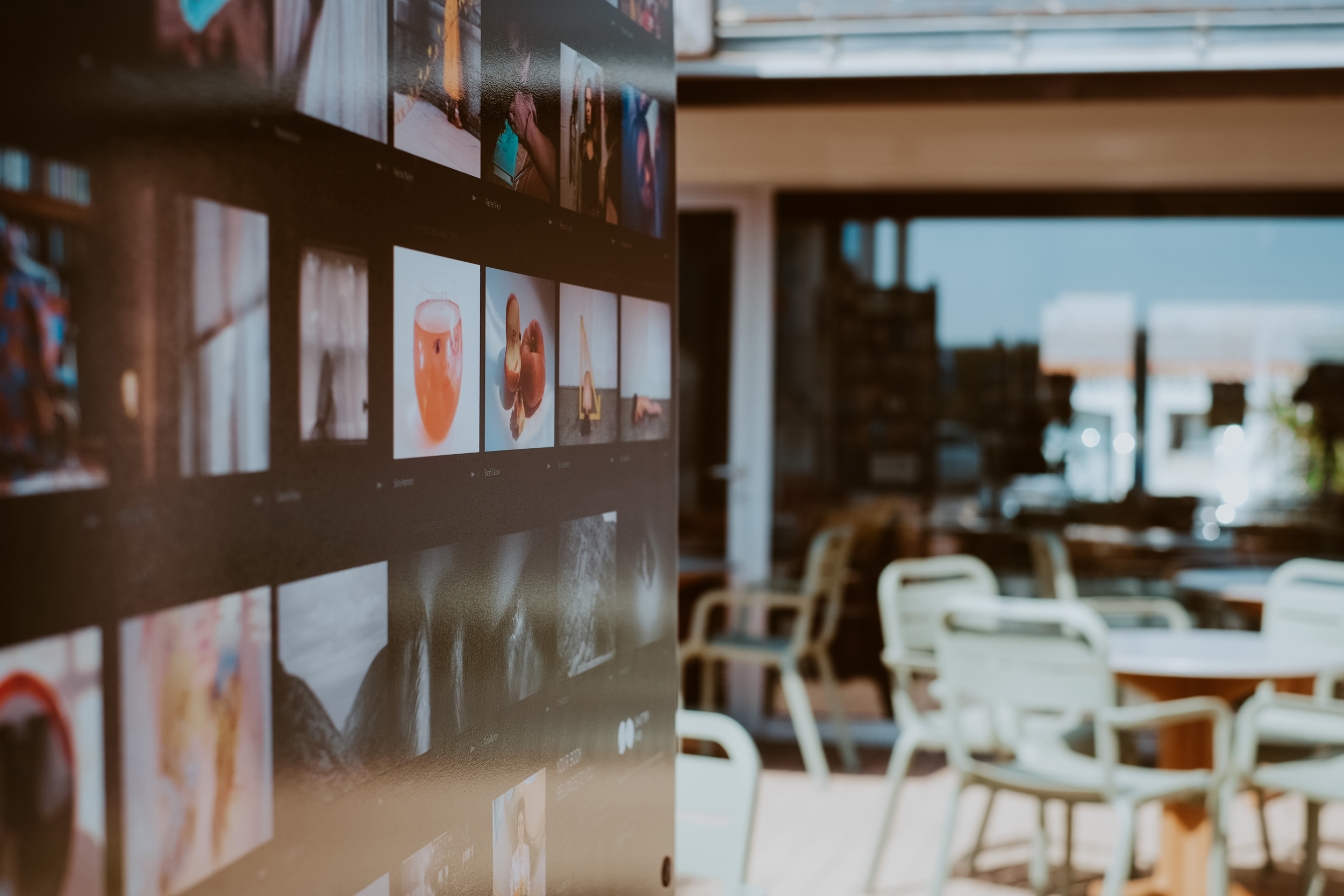 close up photograph of an exhibition panel board displaying photographs in an outside space