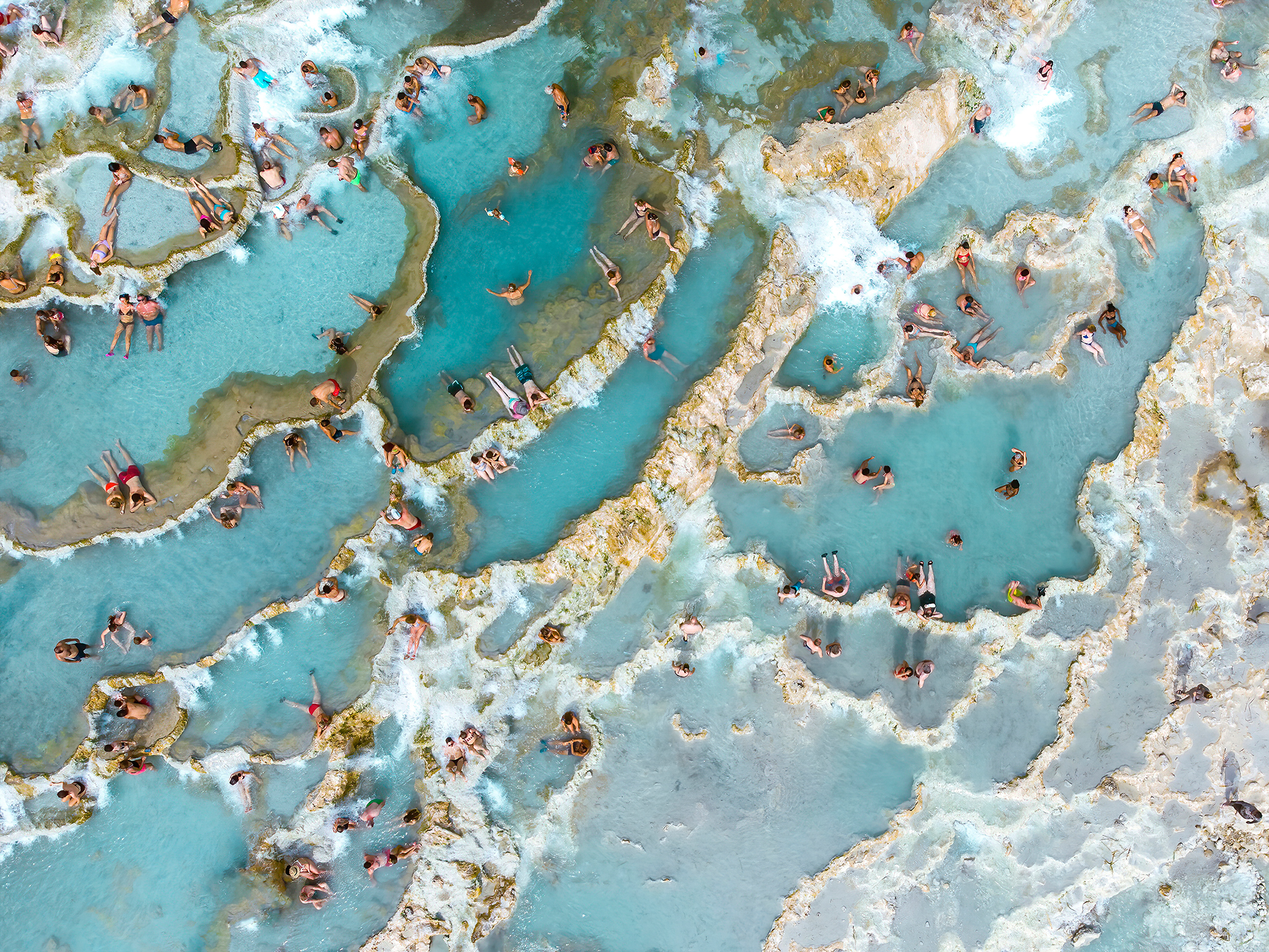 Natural thermal pools created by mineral rich water at Saturnia spring waterfall, in Southern Tuscany