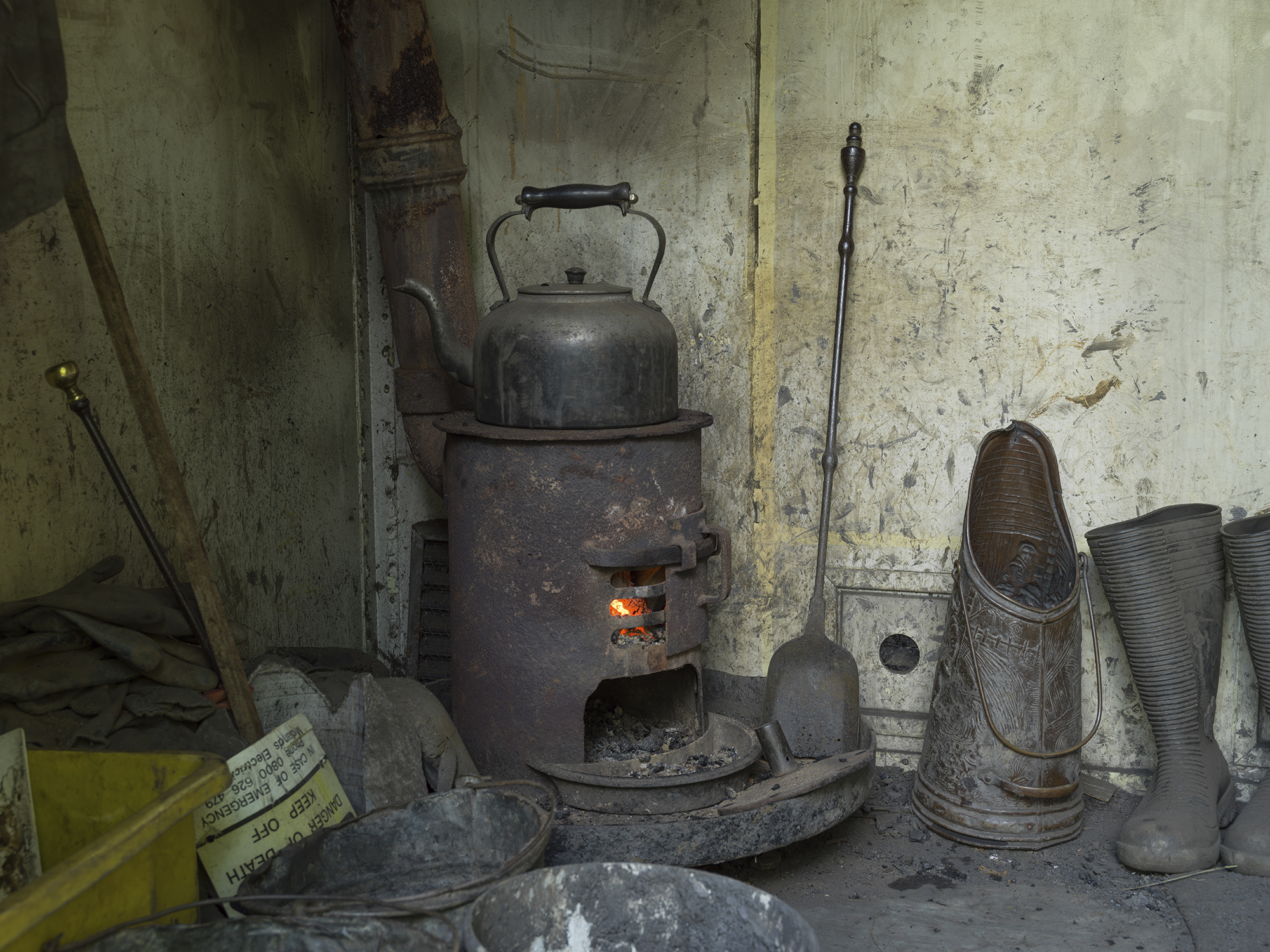 Kettle on stove in mining hut