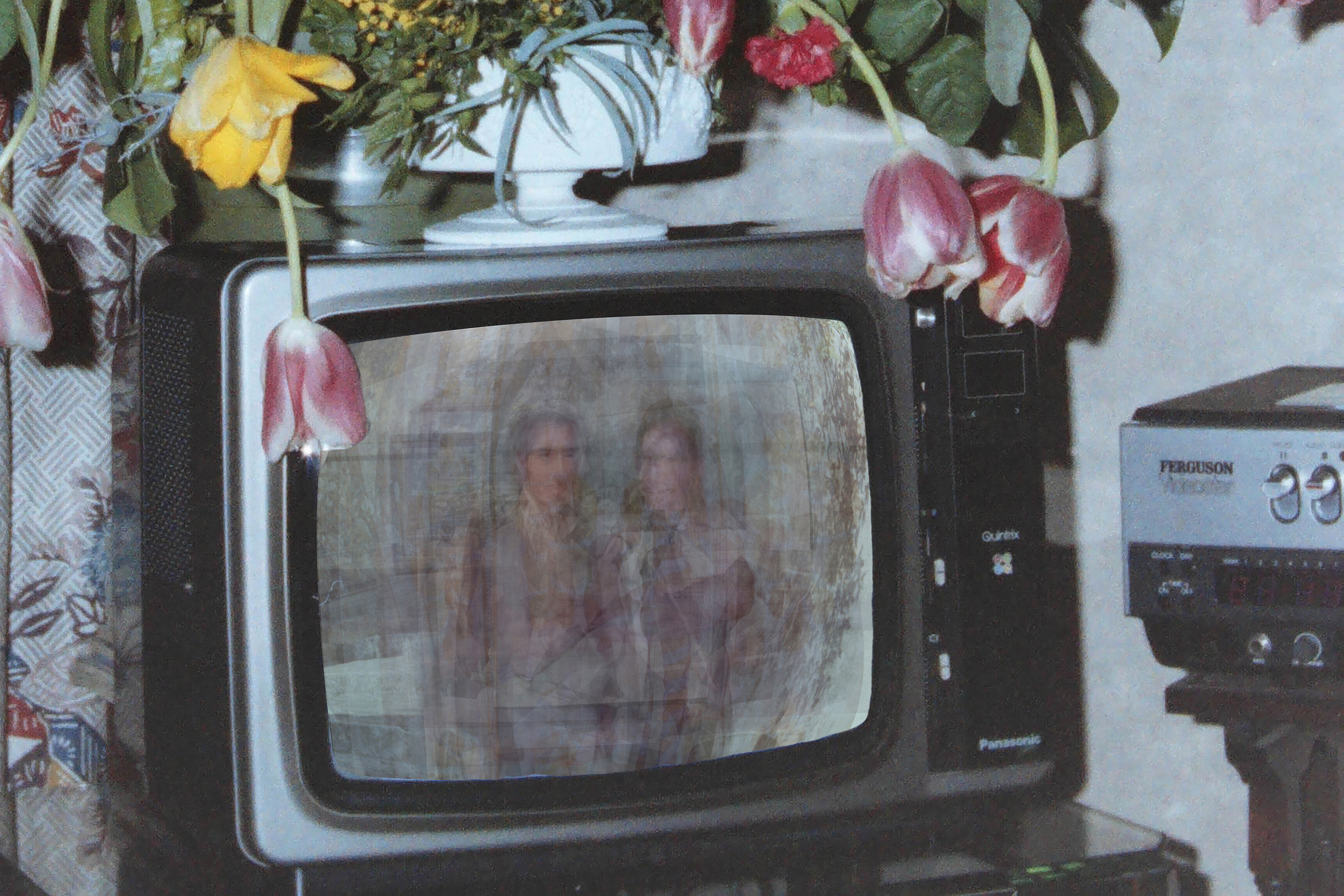 Inside an old television is a layered image of two people in love.